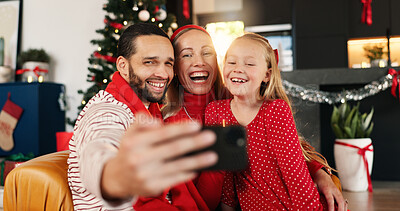 Buy stock photo Christmas, selfie and smile of family in living room of home together for celebration or memories. App, excited or photograph with dad, daughter and mom in apartment for festive profile picture