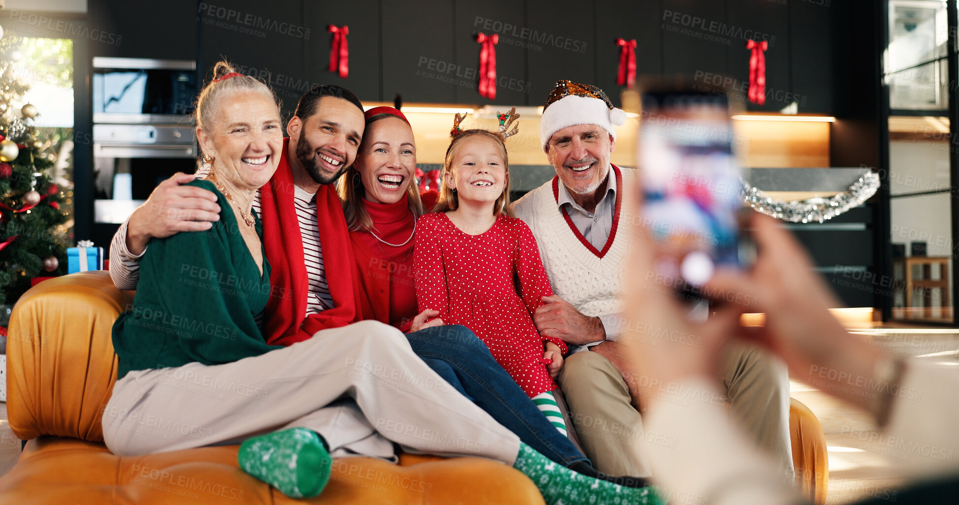 Buy stock photo Photography, happy and family in home for Christmas memory, celebration or social media post. Smile, holiday and girl child with parents and grandparents for picture on xmas for festive season.