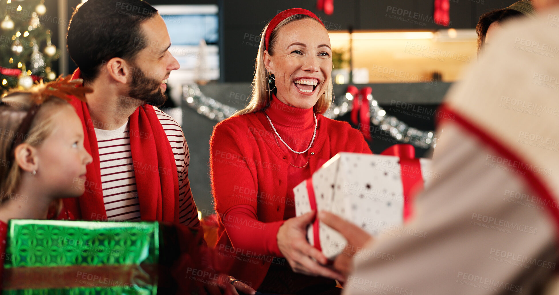 Buy stock photo Christmas, home and family with smile, present and excited with surprise, tradition and festive. Group, gratitude and Xmas with people, gifts and giving with happiness, holiday season and celebration