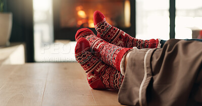 Buy stock photo Christmas, cozy socks and feet of couple in home for vacation break, festive season and bonding. Winter, cuddle and people relax together in lounge for xmas holiday, relationship connection and love