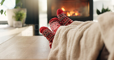 Buy stock photo Christmas, cozy socks and feet of people in home for vacation break, festive season and bonding. Winter, cuddle and couple relax together in lounge for xmas holiday, relationship connection and love