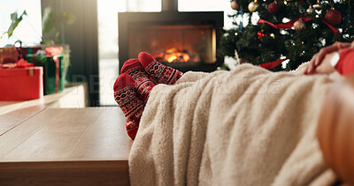 Buy stock photo Christmas, socks and feet of couple in home for vacation break, festive season or cozy bonding. Winter, cuddle and people relax together by fireplace for xmas holiday, relationship connection or love