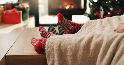 Buy stock photo Christmas, socks and feet of family in home for vacation break, festive season or cozy bonding. Winter, cuddle and people relax together by fireplace for xmas holiday, relationship connection or love