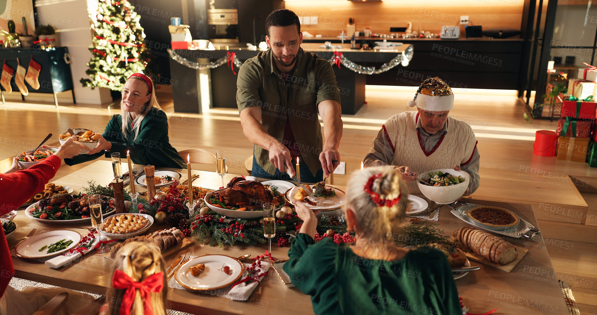 Buy stock photo Above, family and serving food on Christmas celebration, healthy meal and social gathering. Man, people and hosting with cuisine nutrition for festive tradition, feast reunion and bonding at house