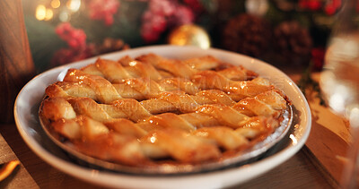 Buy stock photo Christmas, holiday and apple pie on table for festive dessert, tradition and celebration. Sweet snack, event and xmas tart in home for pastry dish, delicious meal or traditional recipe in dining room