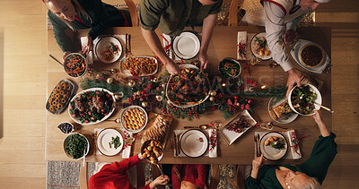 Buy stock photo Festive, meal and people in home, dinner and celebration of Christmas with food at night or reunion. Above, group and family with feast for thanksgiving, evening and together on holiday in house