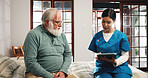 Senior man, nurse and consulting with tablet on bed for schedule activity in retirement home. Caregiver, help and discussion with elderly patient on technology for daily plan or routine in bedroom
