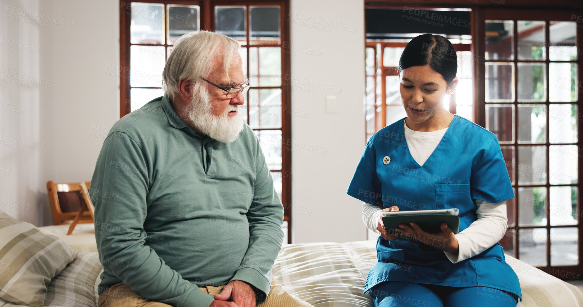 Buy stock photo Senior man, nurse and consulting with tablet on bed for schedule activity in retirement home. Caregiver, help and discussion with elderly patient on technology for daily plan or routine in bedroom