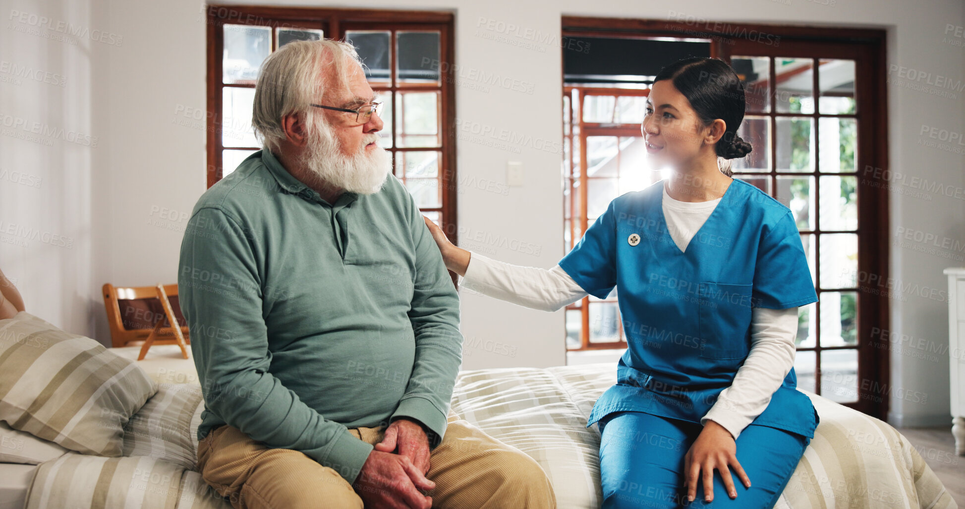 Buy stock photo Comforting, talking and nurse with senior man in bedroom for support, help and care in nursing home. Retirement, healthcare and caregiver with old person for empathy, conversation and consulting