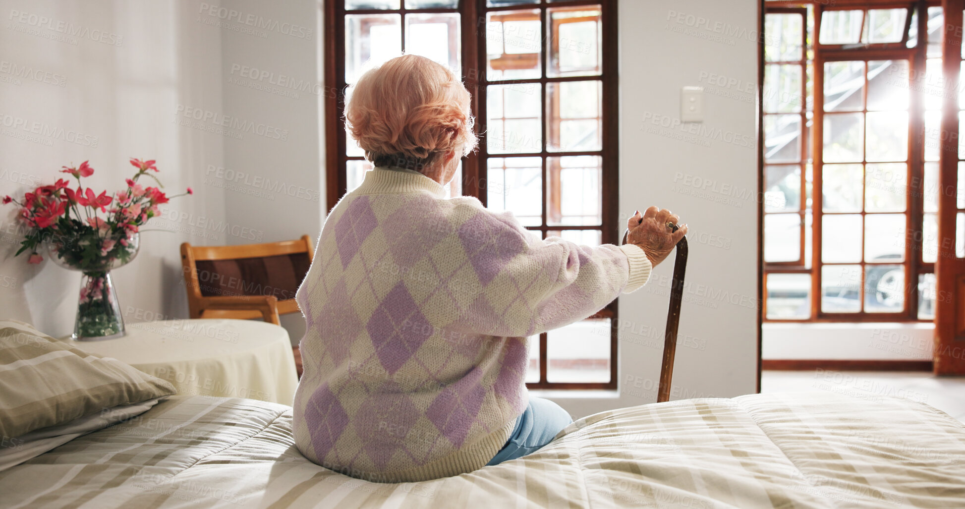Buy stock photo Nursing home, back and senior person with disability, thinking and depression in bedroom and lonely. Retirement, assisted living and pensioner with cane on bed, reflection and memories in house