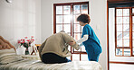 Senior man, caregiver or helping patient on bed for assisted living or support in retirement home. Male person, nurse or assistance in bedroom with client for elderly care or nursing in old age house