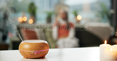 Buy stock photo Aromatherapy, relax and peace with diffuser in home for wellness, bokeh and zen candle. Stress relief, essential oils and smoke with person in living room of apartment for humidifier and self care