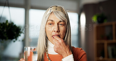 Buy stock photo Senior woman, medicine and water at house for prescription, supplements and healing benefits. Thinking, elderly person and beverage with pills for vitamins, recovery drugs and treatment for wellness