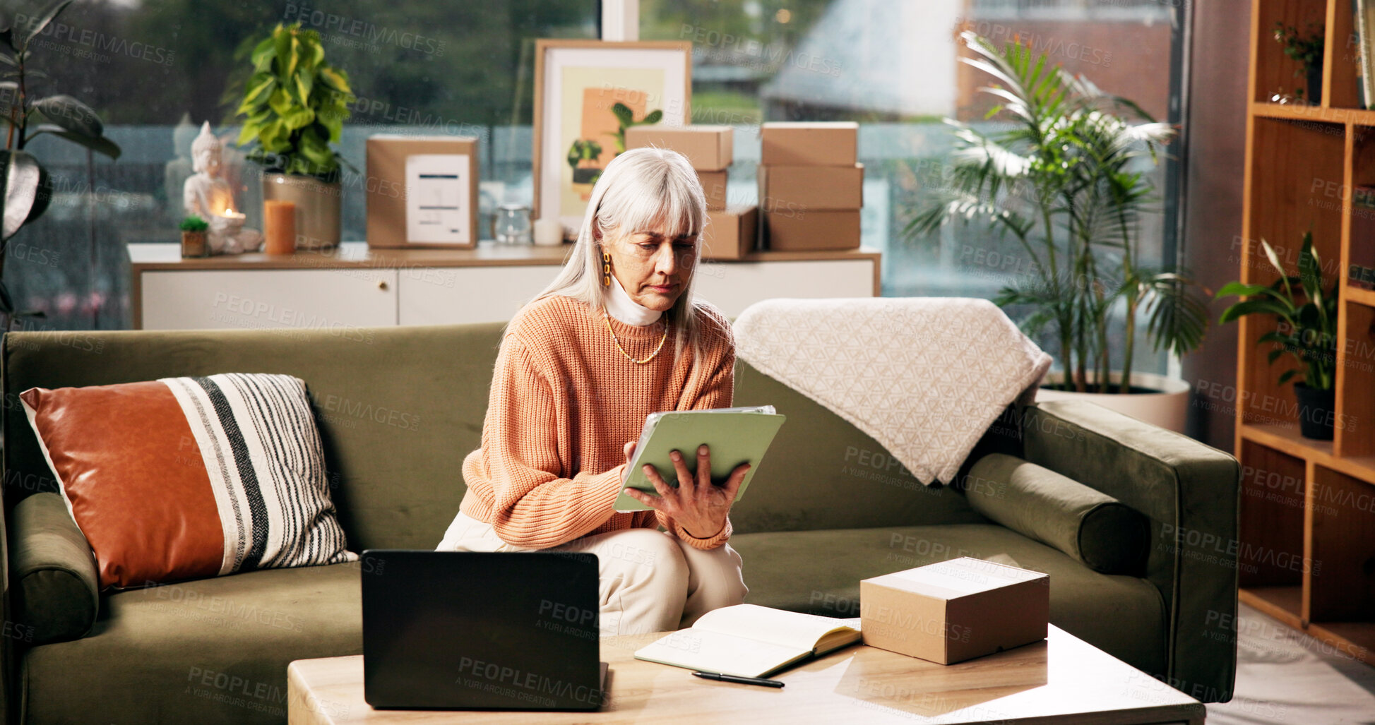 Buy stock photo Tablet, mature woman and box for ecommerce, logistics and check online for order with remote work. Package, technology and freelance entrepreneur in home for stock, shipping or quality control