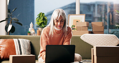 Buy stock photo Laptop, freelancer and boxes with woman on sofa for dropshipping, client email and startup. Small business, ecommerce and delivery schedule with mature person in living room of home for logistics