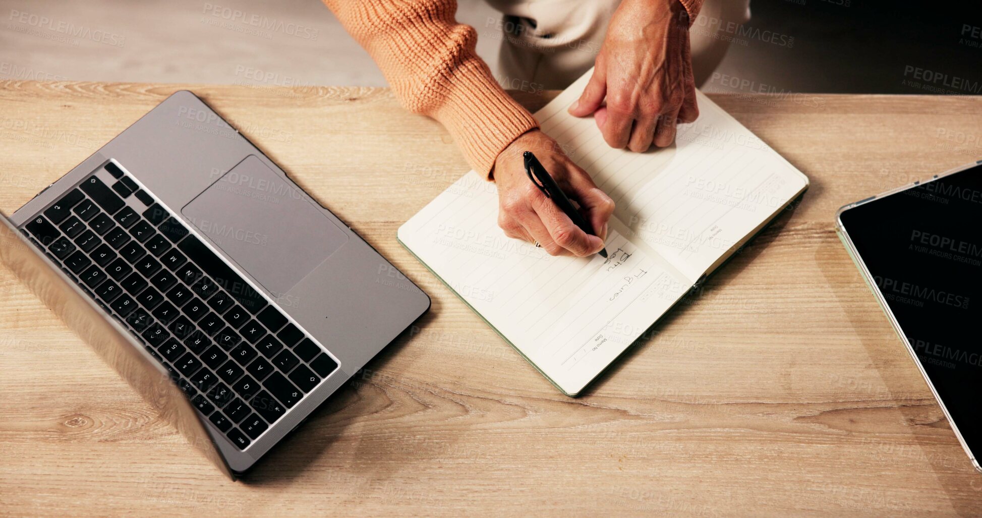 Buy stock photo Hands, above and writing on notebook in home for reminder, agenda or planning with ideas. Journal, laptop and mature person with diary for checklist, tasks and schedule with to do list for notes