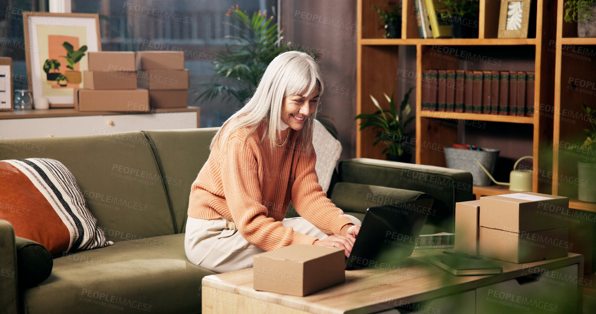 Buy stock photo Laptop, mature woman and smile for order, logistics and check online for ecommerce with remote work. Package, technology and freelance entrepreneur in home for stock, shipping or quality control