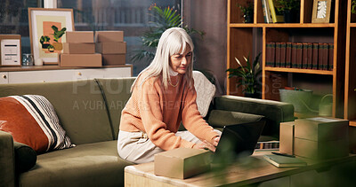 Buy stock photo Laptop, mature woman and living room for order, logistics and check online for ecommerce and remote work. Package, technology and freelance entrepreneur in home for stock, shipping or quality control