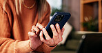 Hands, phone and scroll on sofa in living room with notification, contact or texting on web in retirement home. Person, relax and smartphone for chat, mobile app and social media in lounge at house