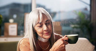 Buy stock photo Senior woman, coffee and thinking on sofa with smile, reflection and inspiration in retirement home. Person, relax and perspective with memory, happy and drink with tea cup in living room at house