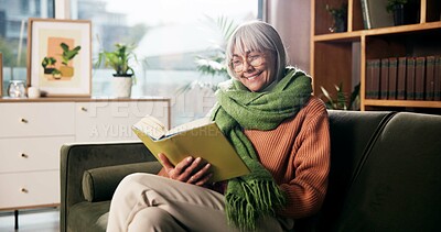 Buy stock photo Senior woman, happy and reading book on sofa for birdwatching hobby, learning and info at retirement home. Person, literature and study for avian animal, knowledge or relax on couch at apartment