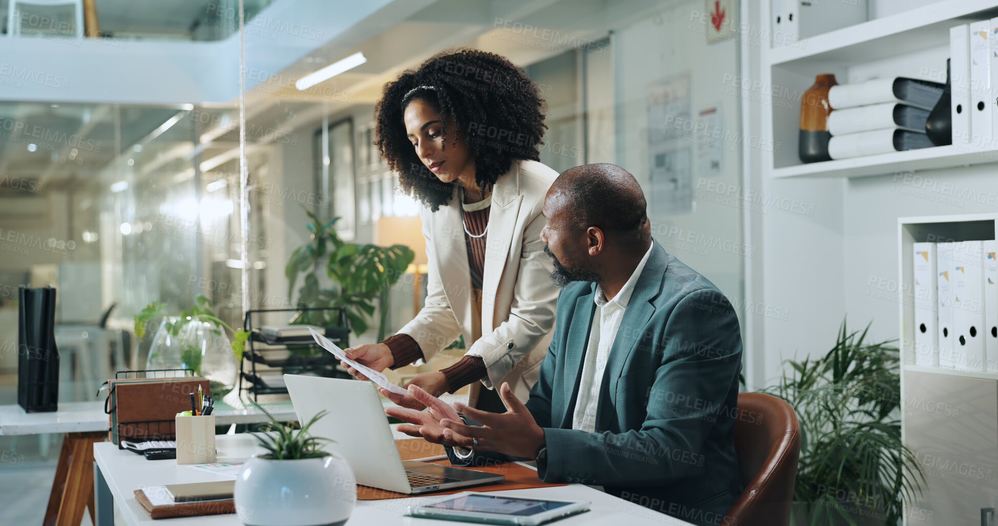 Buy stock photo Document, business people and team brainstorming in office for insurance, meeting or idea at night. Laptop, collaboration and African workers planning, risk assessment or help with policy on overtime