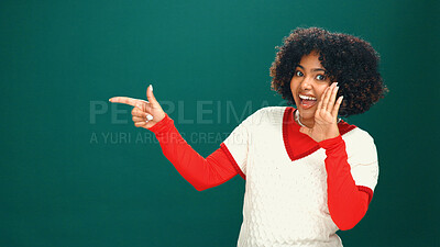 Buy stock photo Christmas, woman and pointing in studio for advertising, mockup space or holiday announcement. Portrait, happy and African person with promo offer, xmas discount and festive sale on green background