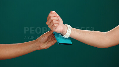 Buy stock photo Hands, POS machine and scan smart watch in studio for cashless transaction, payment and fintech. Mockup space, people and customer with easy checkout on green background for banking, service and sale