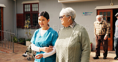 Buy stock photo Holding hands, nurse and help with old woman outdoor for healthcare, occupational therapy and support. Kindness, rehabilitation and medical advice with person in nursing home for trust and caregiver