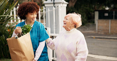 Buy stock photo Home, groceries and senior woman with caregiver for assistance, support and care walking to door. Retirement, nurse and elderly person with shopping bag of food outdoor for kindness, service and help