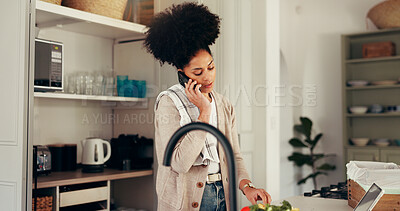 Buy stock photo Phone call, cooking and woman in kitchen for nutrition, healthy diet or recipe tips. Food, meal prep and African person with tech in home for chat, talk and advice with vegetables for organic salad