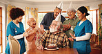 Birthday cake, senior people and clapping in nursing home for celebration, support or excited. Dessert, retirement group and friends at party, special event and congratulations with medical caregiver