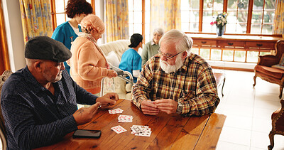 Buy stock photo Senior men, friends and playing cards in homecare for contest, friendly competition and hobby. Elderly people, game bet and challenge for retirement entertainment, cognitive activity and nursing home