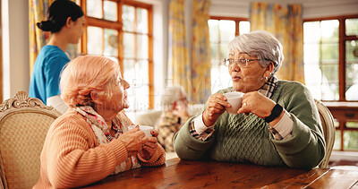 Buy stock photo Nursing home, friends and old women with coffee, bonding or discussion in morning with hot beverage. Assisted living, elderly people and conversation with tea, chat and happy in house and retirement