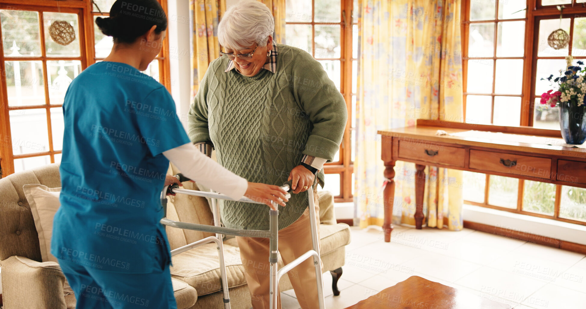 Buy stock photo Senior woman, caregiver and healthcare with walker in retirement home for mobility or assisted living. Nurse, walking and elderly patient with aid for physiotherapy or rehabilitation in old age house