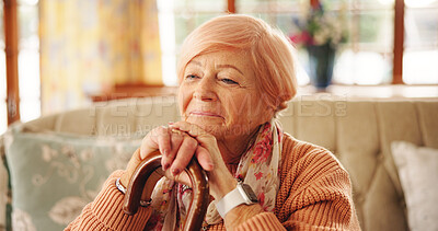 Buy stock photo Cane, thinking and senior woman in home with hope, nostalgia and memory with vision. Walking stick, reflection and elderly person with disability, happiness and remember in retirement in living room