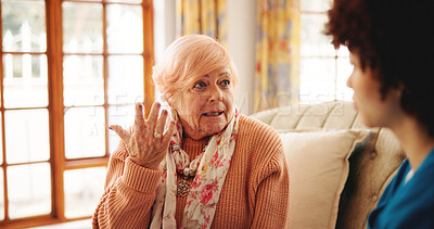Buy stock photo Consultation, home and nurse with senior woman on sofa for diagnosis, checkup or treatment plan. Healthcare, conversation and medical caregiver with elderly female person for discussion at house.