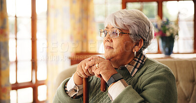 Buy stock photo Walking stick, thinking and senior woman in home with nostalgia, retirement or remember memory. Ideas, wood cane and elderly female person with a disability on sofa with daydreaming in house.