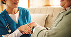 Holding hands, comfort and nurse with senior woman in retirement home with support for diagnosis. Healthcare, compassion and caregiver with elderly female person for medical consultation in house.