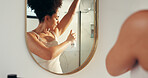Woman, deodorant and mirror for underarm, smell or clean armpit in home bathroom. Female person, skincare and reflection for fresh aroma, hygiene or perfume for wellness and morning routine fragrance