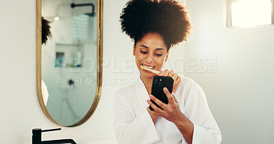 Buy stock photo Phone, dental hygiene and woman brushing teeth in bathroom with networking on mobile app. Oral care, technology and female person cleaning mouth for morning routine with social media on cellphone.