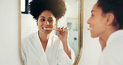 Buy stock photo Woman, brushing teeth and smile with mirror in bathroom for reflection, cleaning mouth and routine. African person, toothbrush and oral care for dental health, wellness or sustainability in house