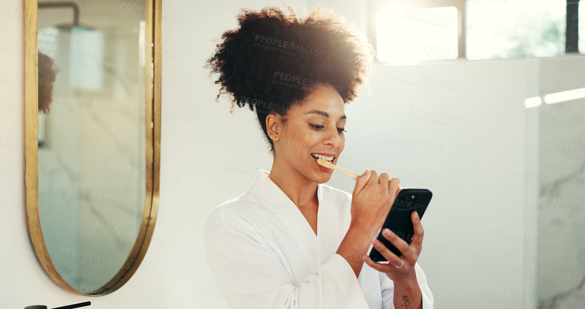Buy stock photo Cellphone, dental hygiene and woman brushing teeth in bathroom with networking on mobile app. Oral care, technology and female person cleaning mouth for morning routine with social media on phone.