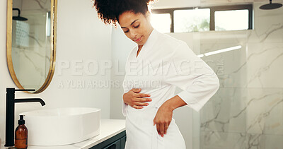 Buy stock photo Home, woman and check bathrobe for beauty, morning routine and spa preparation by mirror. Bathroom, person and ready with dressing gown for self care, clean and start day with luxury for wellness