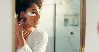 Buy stock photo Woman, gua sha and skincare with eye patch for circulation, anti aging or facial healing in home. Mirror, person and bathroom with reflection for lymphatic drainage, dermatology or skin treatment