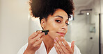 Woman, portrait and gua sha for facial massage in bathroom for morning routine, skincare and antiaging. Face, pov and African person for natural cosmetics tool, jade stone and self care in house