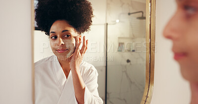 Buy stock photo Face mask, skincare and woman in bathroom by mirror for cosmetics, health and glow routine. Wellness, beauty and female person with facial clay for dermatology treatment in morning at apartment.