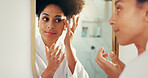 Woman, mirror and beauty with skin check for morning routine in bathroom, face and cosmetics. African person, reflection and daily skincare for dermatology, wellness and facial results in home