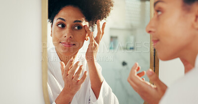 Buy stock photo Woman, mirror and beauty with skin check for morning routine in bathroom, face and cosmetics. African person, reflection and daily skincare for dermatology, wellness and facial results in home