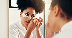 Eye mask, skincare and woman by mirror in bathroom for hydration, glow or facial routine in morning. Beauty, wellness and female person with cosmetic product for dermatology treatment in home.